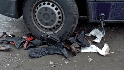 Footwear Crushed Under Muddy Tires