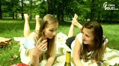 Two Barefoot Chicks In Park Having Their Feet Worshiped By A Stranger